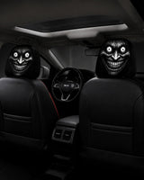 GhostRideGrin creepy grin headrest cover in a car
