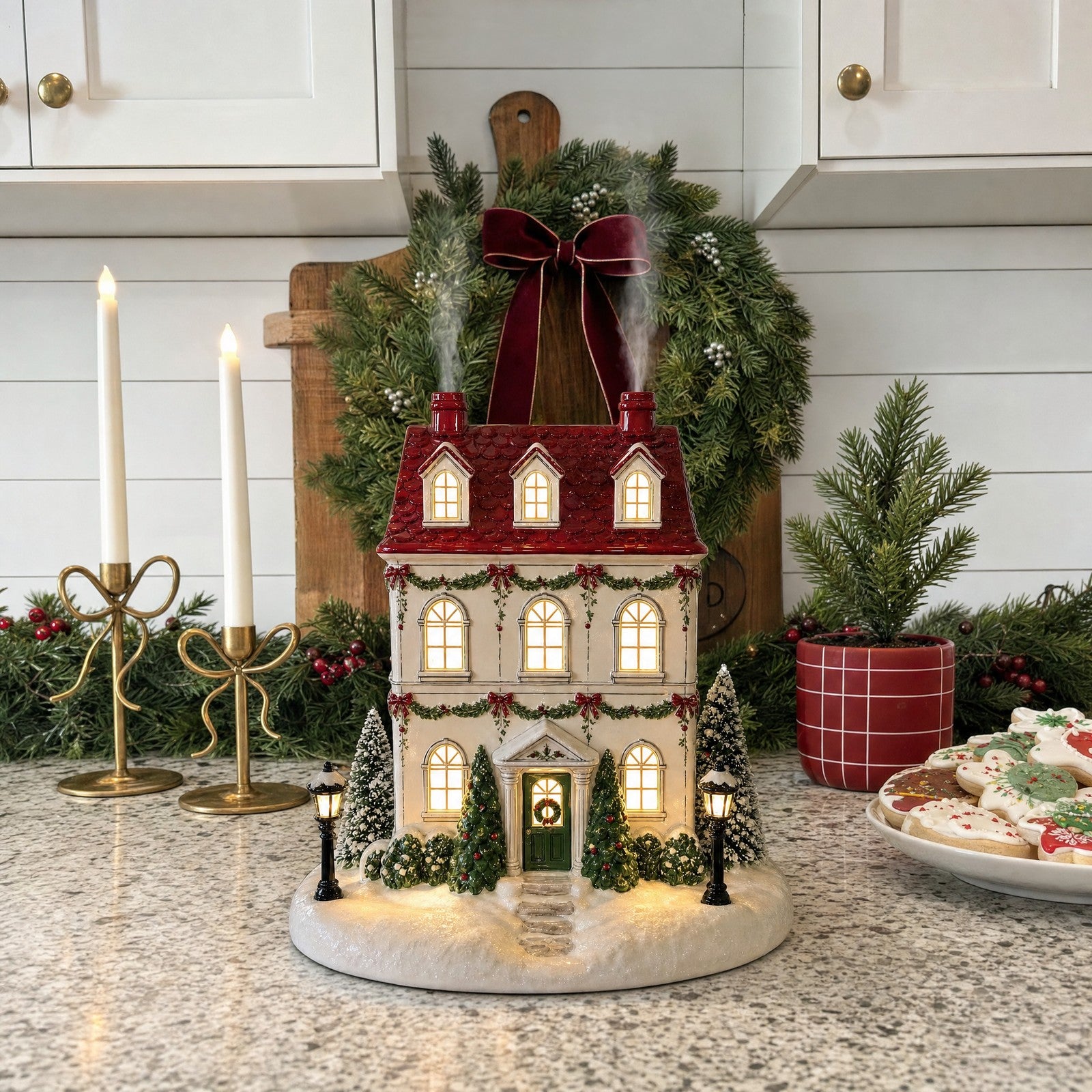 Christmas cottage diffuser glowing in a cozy home setting